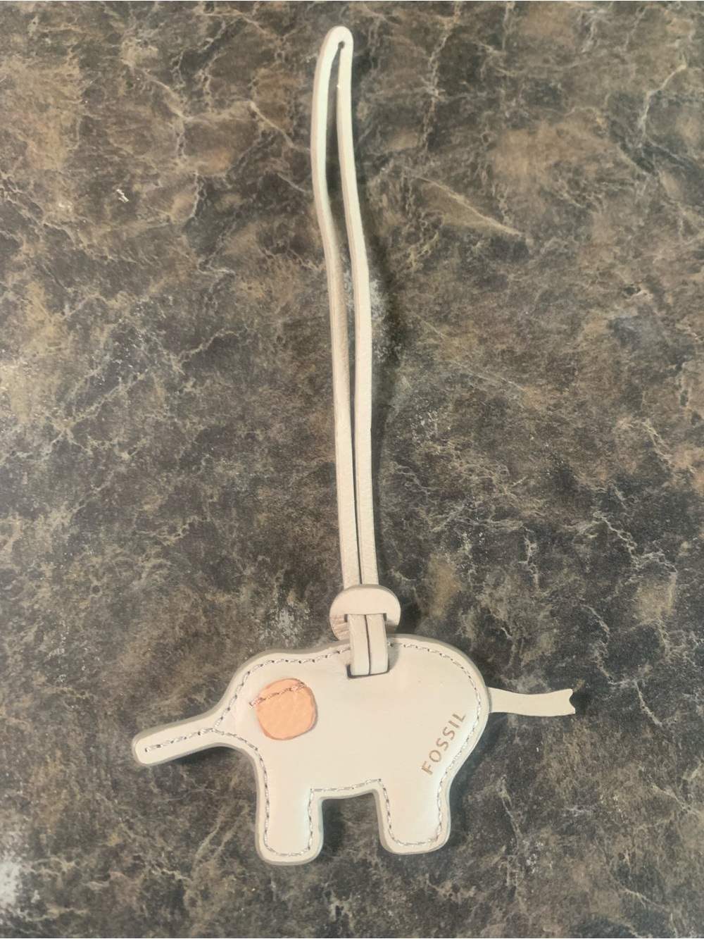 Leather fossil elephant charm for purse, good condition. Non smoking home.